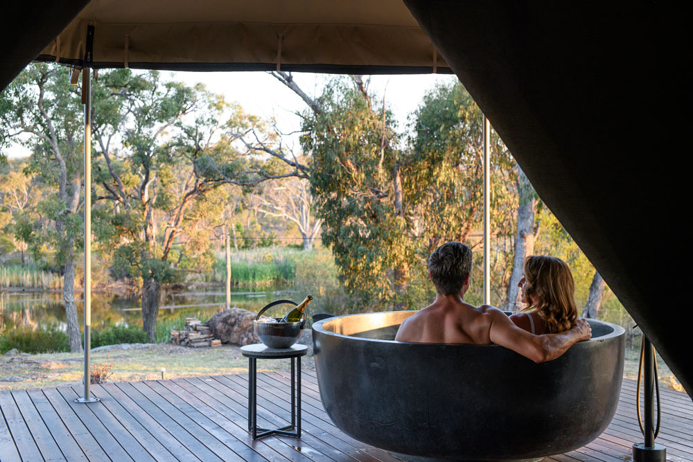 Serenita Stanthorpe Servern Glamping Tent couple having a bath outside